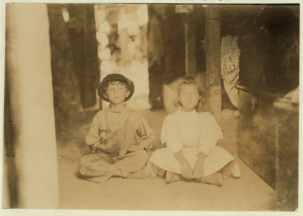 "No. 846-847. Name: These Children are representatives of the two families that occupy this one room in a shack on Bottomley's Farm, Baltimore, Md. There are only sliding curtains to separate families. Bunks on floor above. July 7, 1909.", 1909 - Lewis Hine - <i>Library of Congress</i>