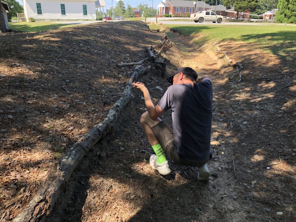 My nephew tries out the defenses at New Hope Church. - <i>Photo by the author</i>