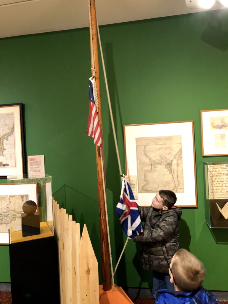 John raises the stars-and-stripes over "Fort Miffln" - <i>Photo by the author</i>