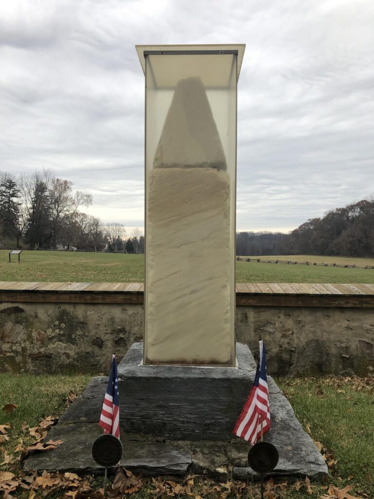 The monument to the 53 American soldiers who are buried here.  The monument itself is over 200 years old, so it is being preserved. - <i>Photo by the author</i>