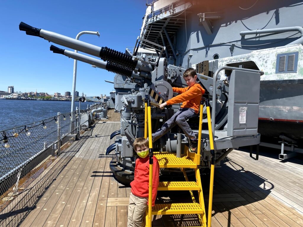 John mans the Bofors gun while Isaac waits for his turn. - <i>Photo by the author</i>