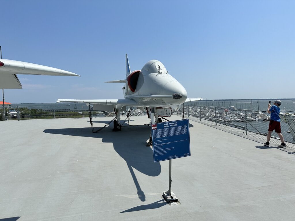 John taking a load of pictures of his favorite Navy jet - the A4 Skyhawk. - <i>Photo by the author</i>