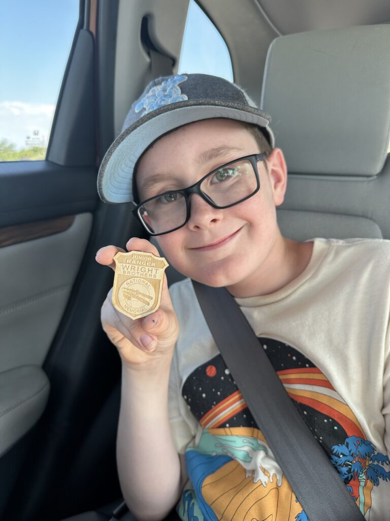 John with his latest Junior Ranger badge. - <i>Photo by the author</i>