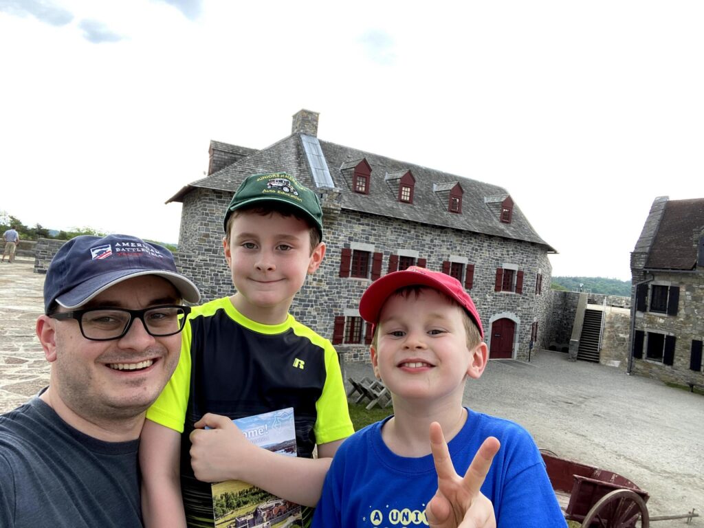 #FortSelfie! My crew poses with the parade ground in the background. - <i>Photo by the author</i>