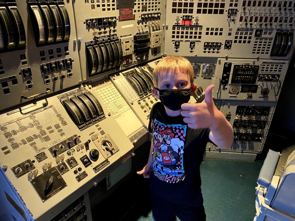 Isaac approves of the dummy control panels in the museum. He loves buttons and switches! - <i>Photo by the author</i>