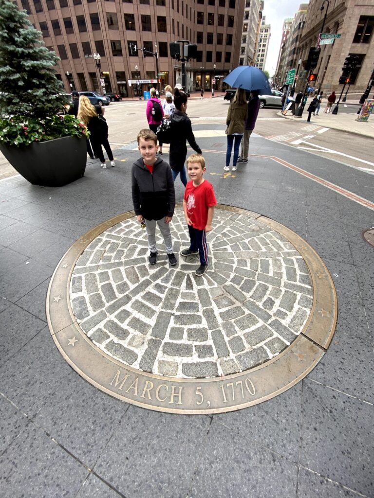 The boys at the site of the Boston Massacre. - <i>Photo by the author</i>