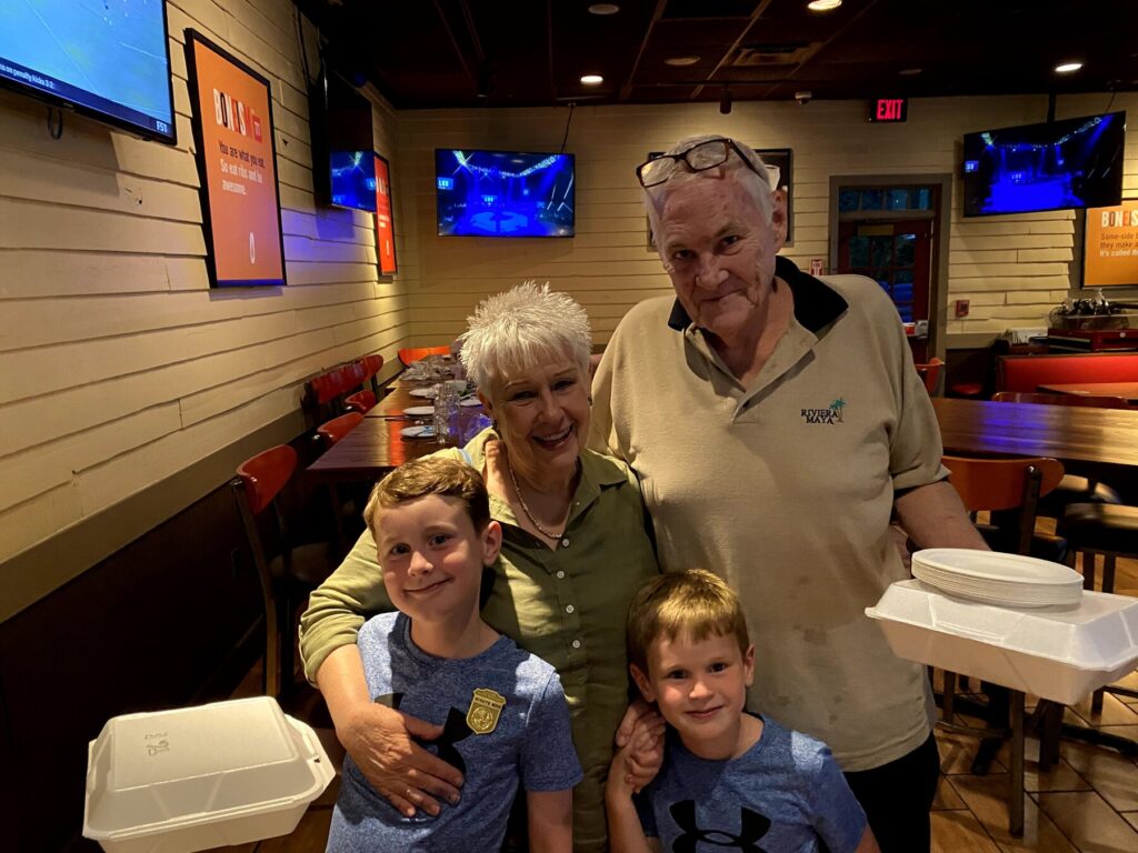 "Nene" and her brother pose with my boys after dinner. - <i>Photo by the author</i>