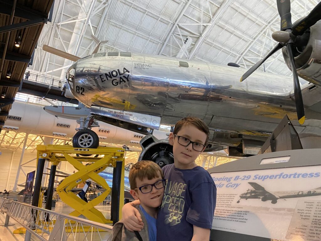 The boys pose with the <i>Enola Gay</i> - <i>Photo by the author</i>