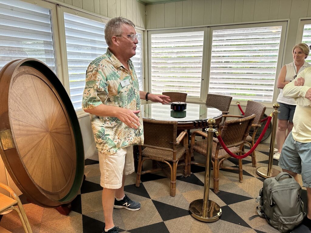 Chet talks about the card table. The top cover rests behind him. - <i>Photo by the author</i>