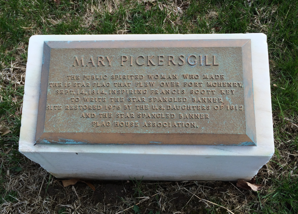 The historical plaque placed at the grave.