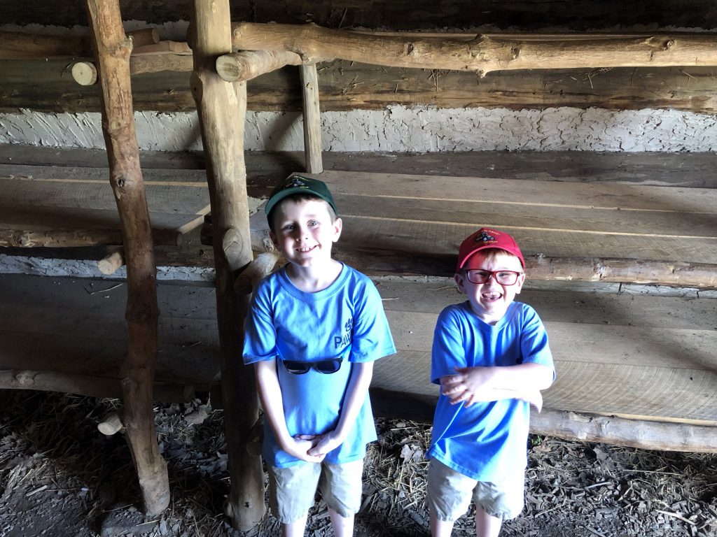 John and Isaac inside one of the soldiers' huts. - Photo by the Author