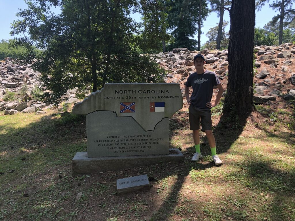 My nephew poses with the monument to North Carolina troops at Allatoona. - <i>Photo by the author</i>