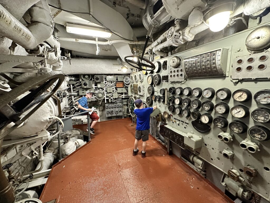 Isaac loves all the controls and gauges in the engine room. - <i>Photo by the author</i>