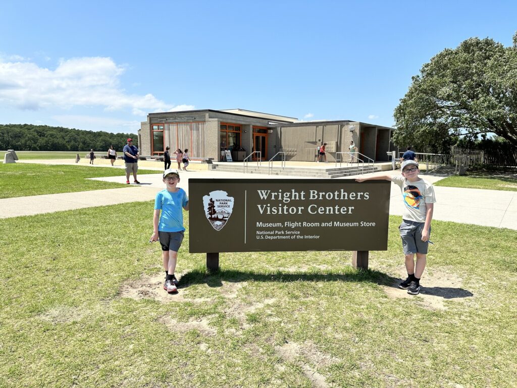 Posing with the sign out in front of the visitors center. - <i>Photo by the author</i>