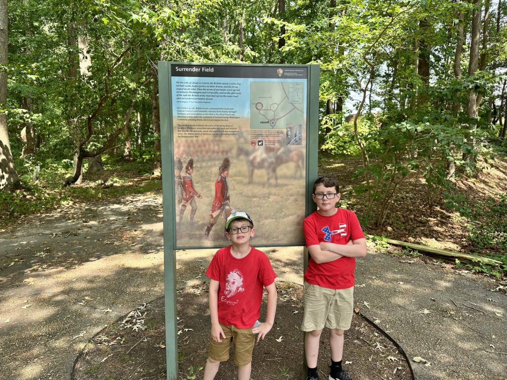 The boys at the site of the British surrender. - <i>Photo by the author</i>