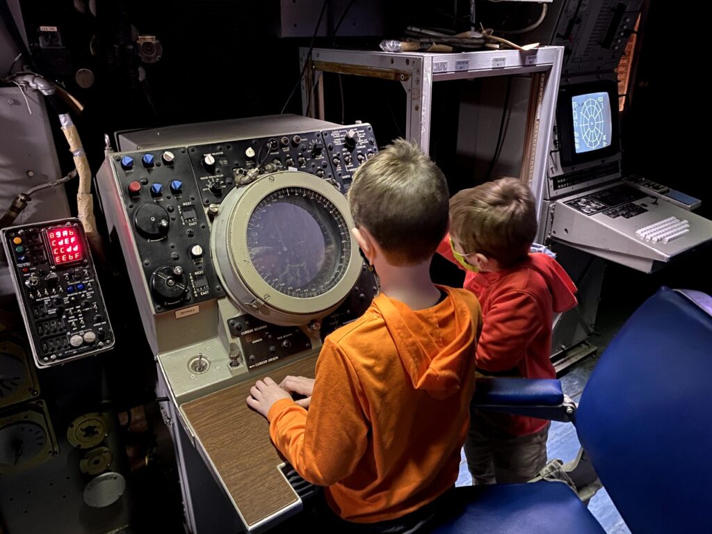 The boys checking out the radar screen in the CEC. - <i>Photo by the author</i>