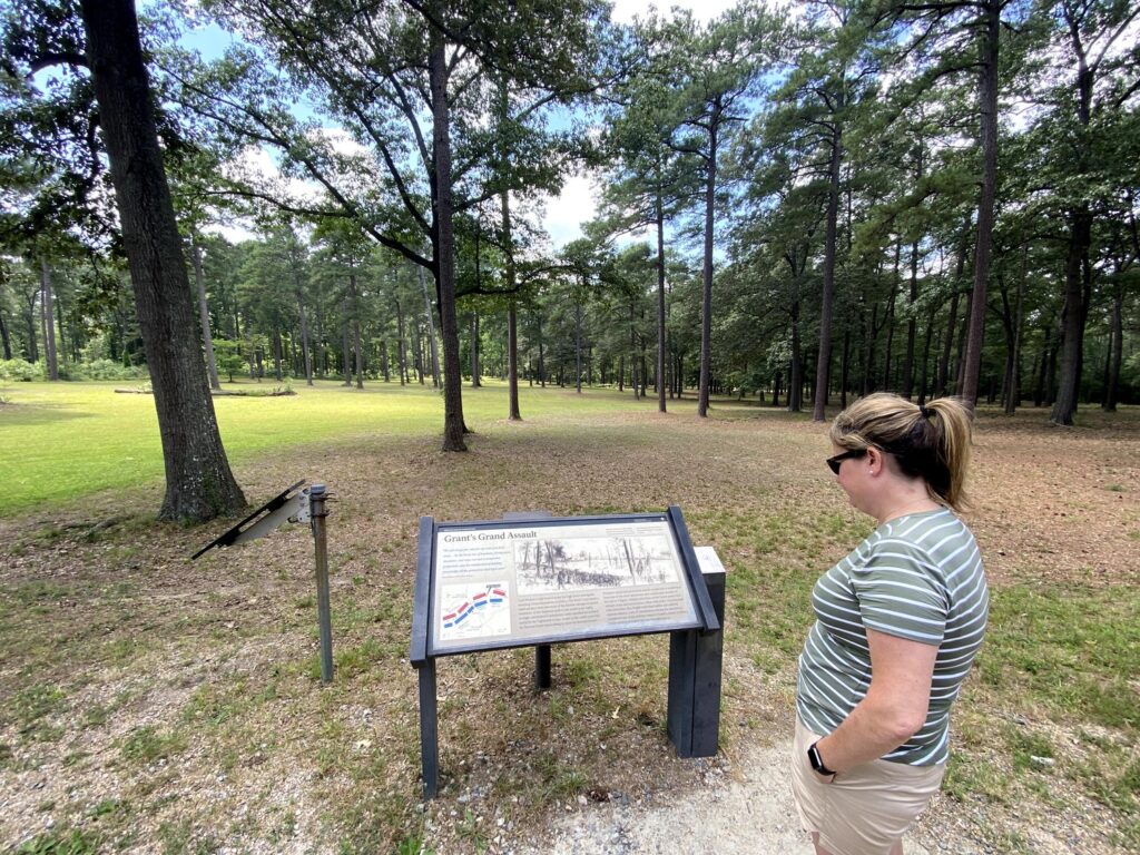 Emily checks out a wayside marker at one of the Cold Harbor auto tour stops. - <i>Photo by the author</i>