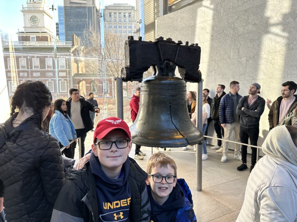 The boys pose in front of the Liberty Bell. - <i>Photo by the author</i>